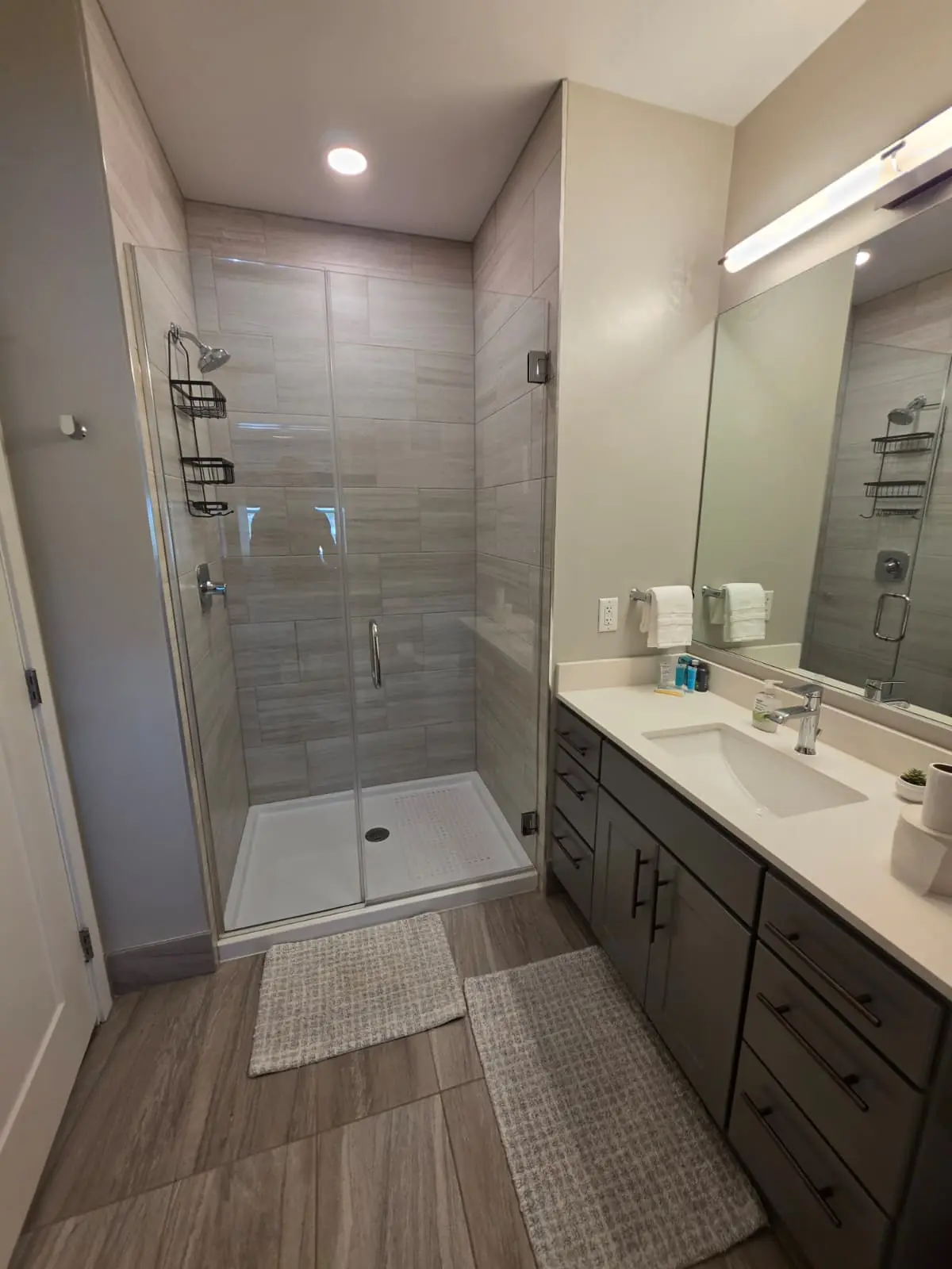 Bathroom with double vanity and fresh towels in a furnished Aurora, Colorado rental
